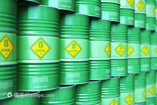 創意抽象生態替代可持續能源和環境保護節約商業概念3D以選擇重點效果說明工業儲存倉庫中的綠色堆疊金屬生物燃料桶或柴油